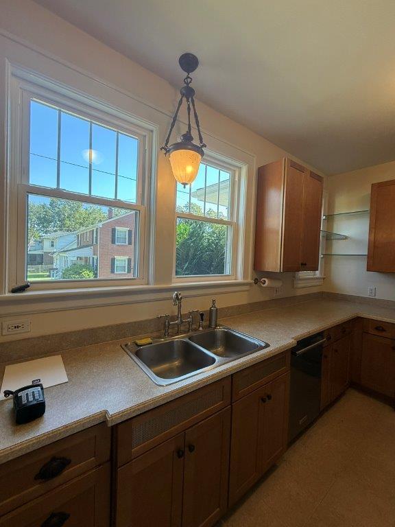 1901 Avon Road Southwest, Unit LOWR Roanoke, VA 24015 - Photo 16 of 31 a kitchen with a sink a window and cabinets