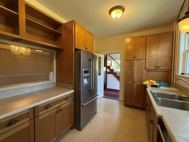 a kitchen with stainless steel appliances a refrigerator and a stove