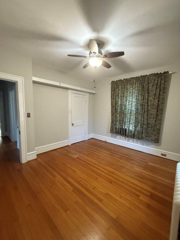 1901 Avon Road Southwest, Unit LOWR Roanoke, VA 24015 - Photo 2 of 31 a view of empty room with wooden floor and fan