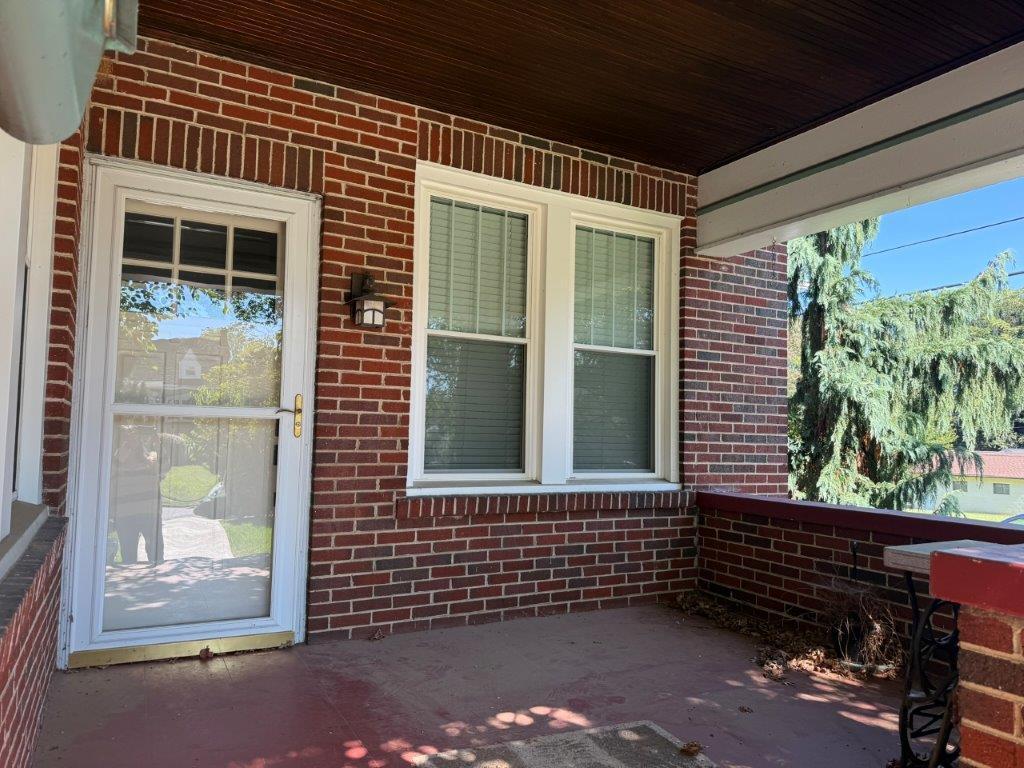 1901 Avon Road Southwest, Unit LOWR Roanoke, VA 24015 - Photo 24 of 31 a front view of a house with a yard