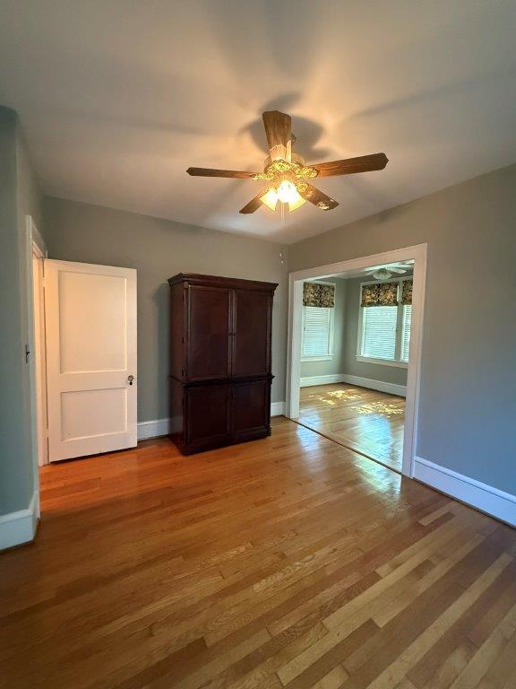 1901 Avon Road Southwest, Unit LOWR Roanoke, VA 24015 - Photo 8 of 31 a view of an empty room with a window and wooden floor