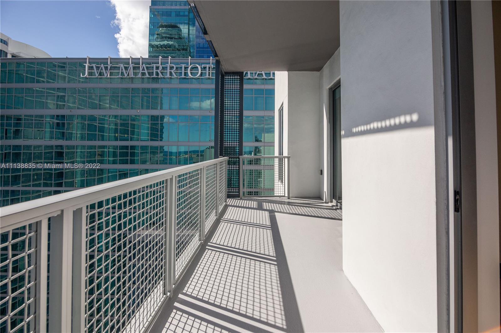 340 Southeast 3rd Street, Unit PH4 Miami, FL 33131 - Photo 16 of 62 a view of balcony with wooden floor