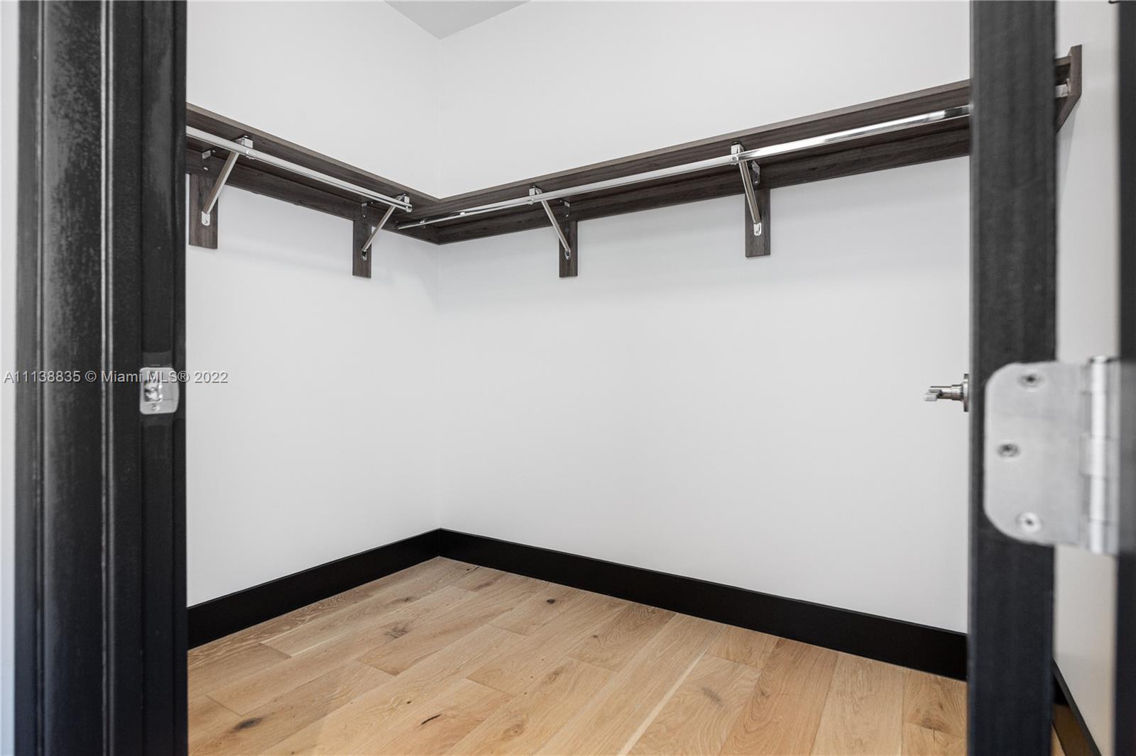 340 Southeast 3rd Street, Unit PH4 Miami, FL 33131 - Photo 27 of 62 a view of a room with rack on the wall