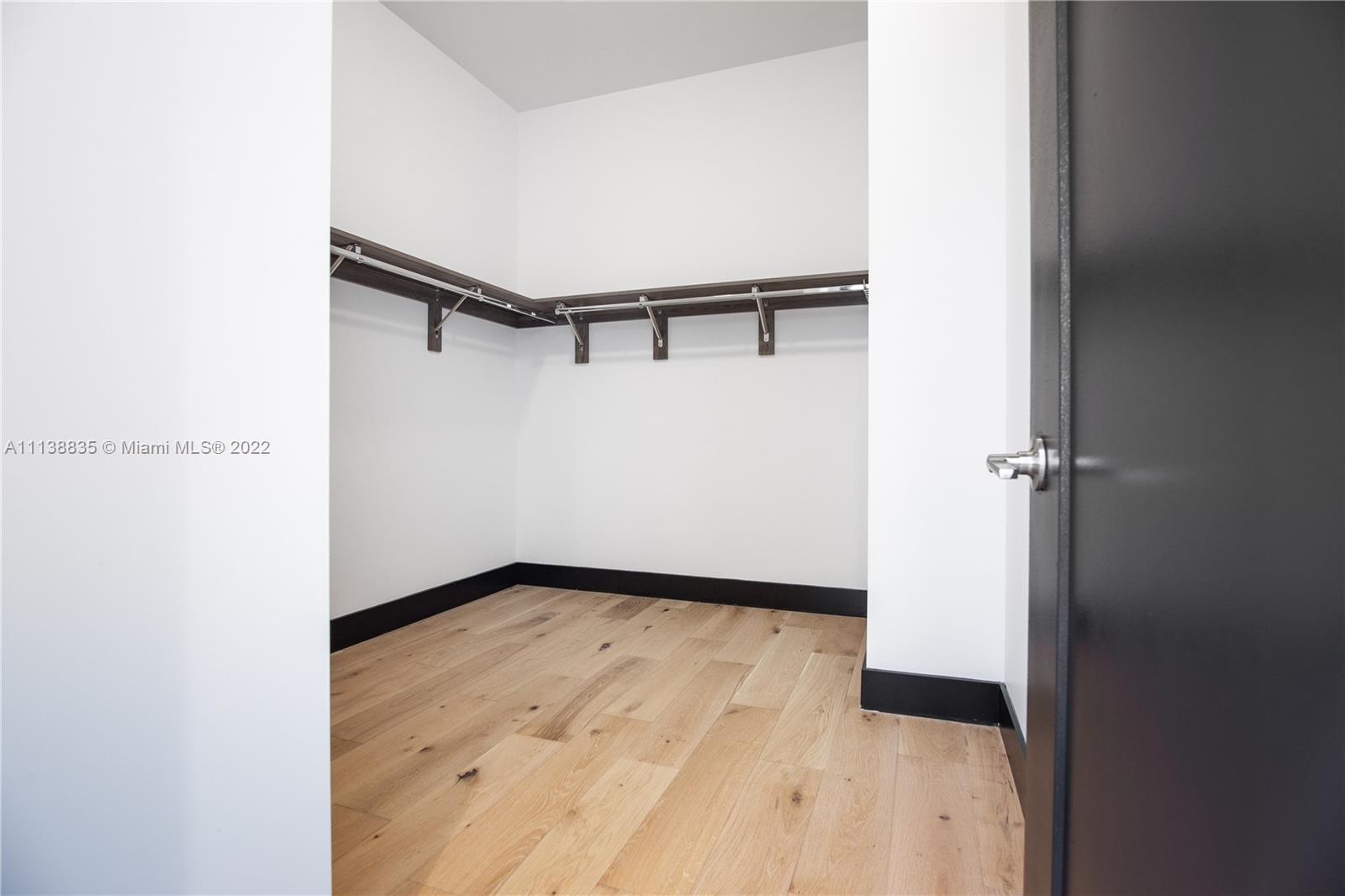 340 Southeast 3rd Street, Unit PH4 Miami, FL 33131 - Photo 28 of 62 a view of a room with wooden floor