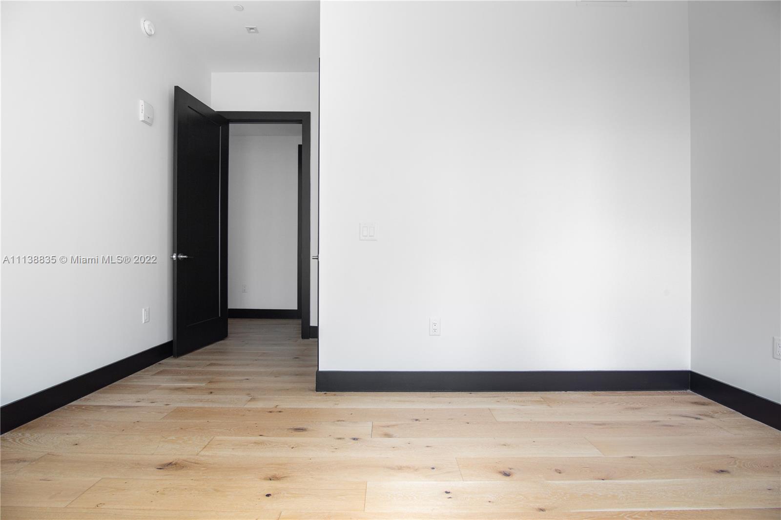 340 Southeast 3rd Street, Unit PH4 Miami, FL 33131 - Photo 42 of 62 a view of wooden floor