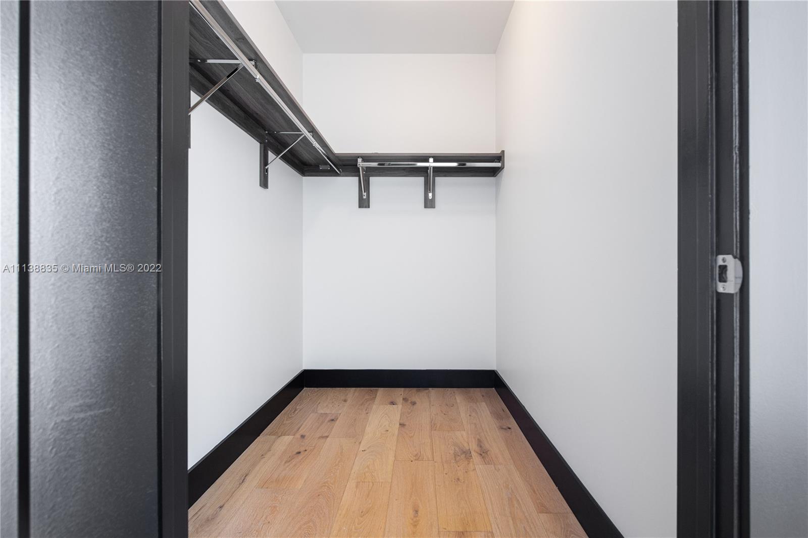 340 Southeast 3rd Street, Unit PH4 Miami, FL 33131 - Photo 43 of 62 a view of a hallway with wooden floor and a hallway