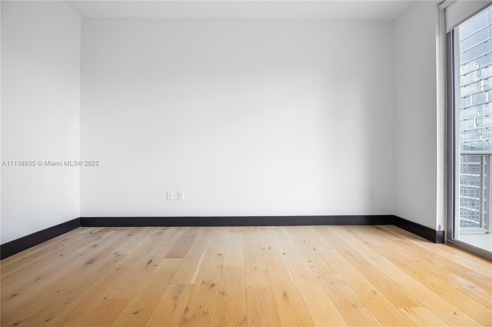 340 Southeast 3rd Street, Unit PH4 Miami, FL 33131 - Photo 51 of 62 a view of an empty room and window