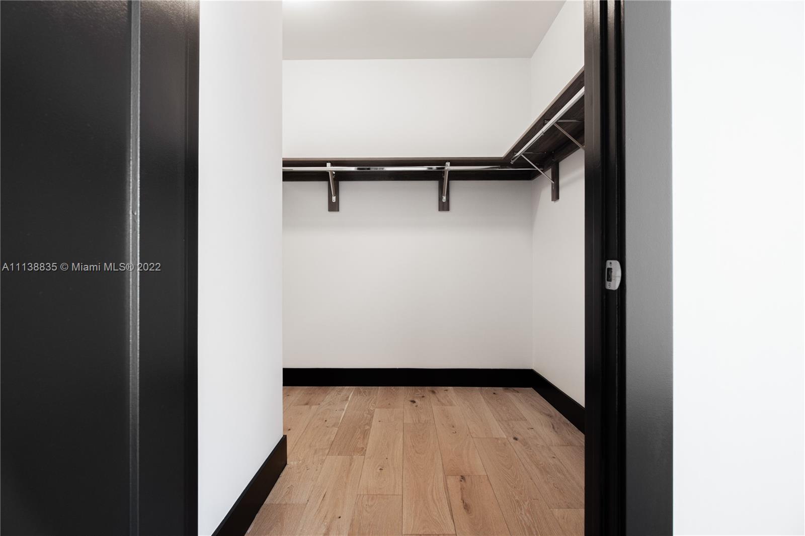 340 Southeast 3rd Street, Unit PH4 Miami, FL 33131 - Photo 52 of 62 a view of walk in closet with empty racks