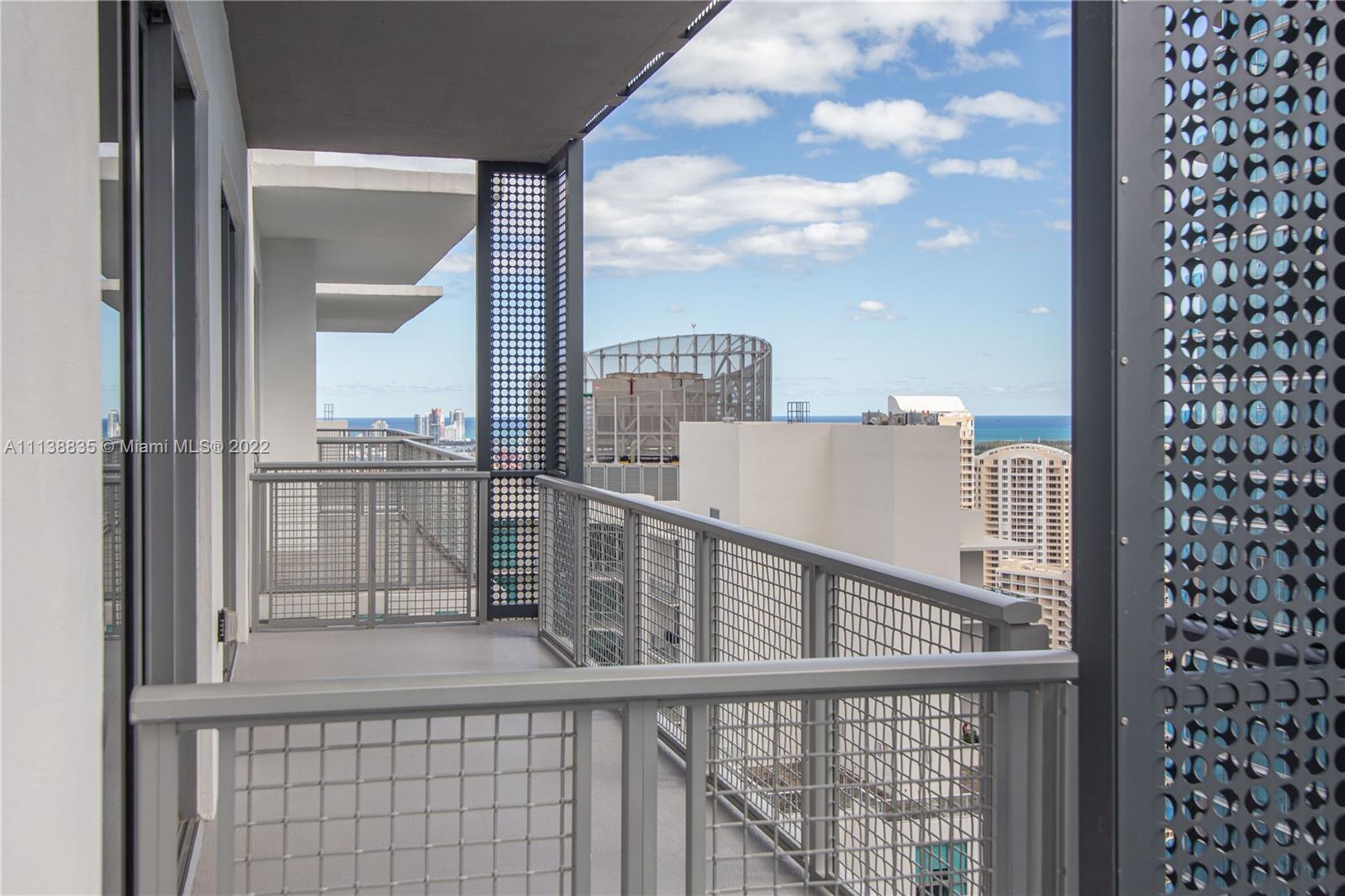 340 Southeast 3rd Street, Unit PH4 Miami, FL 33131 - Photo 62 of 62 a view of a balcony from a window