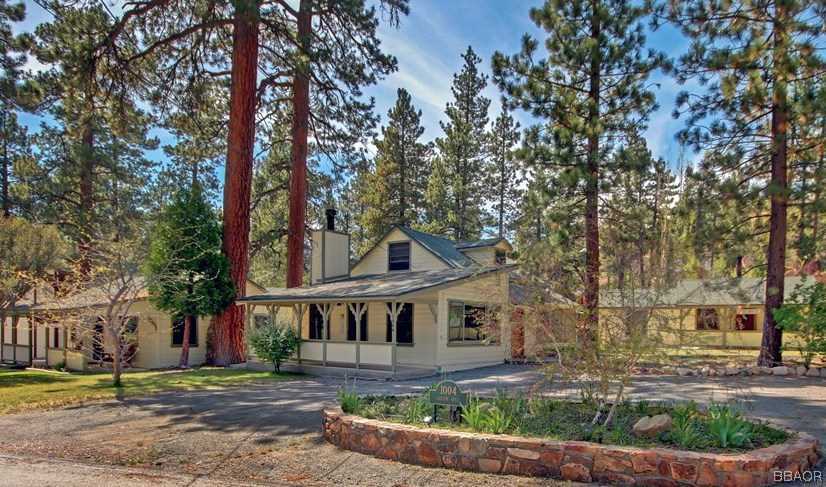 1004 Canyon Road Fawnskin, CA 92333 - Photo 1 of 25 a front view of a house with garden