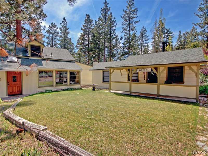 1004 Canyon Road Fawnskin, CA 92333 - Photo 23 of 25 a view of a house with backyard and tree