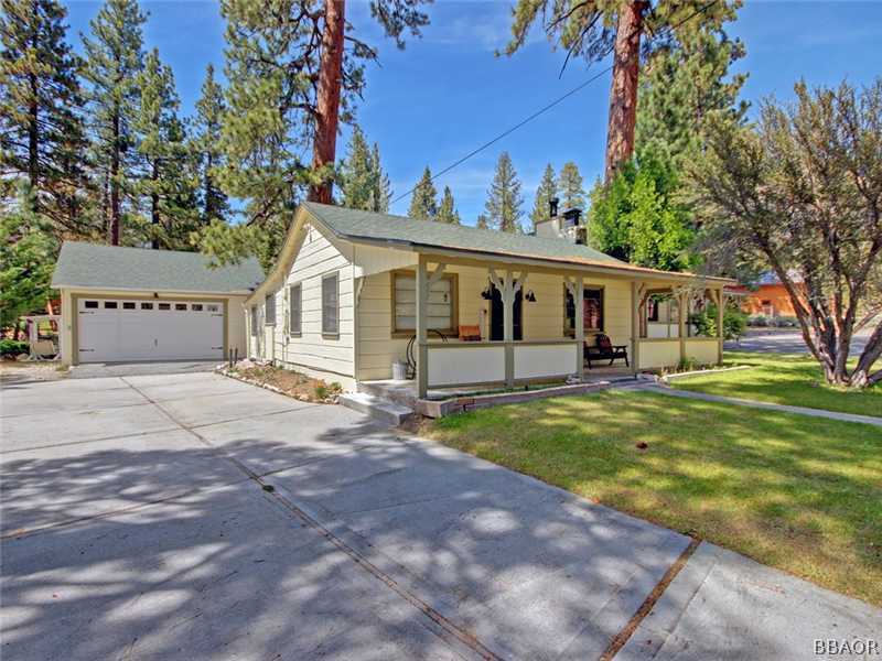 1004 Canyon Road Fawnskin, CA 92333 - Photo 8 of 25 a view of a house with backyard and a tree