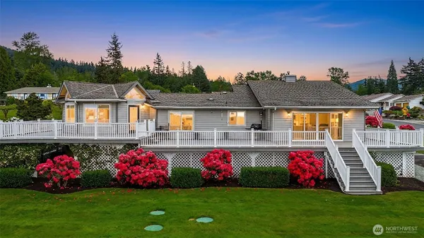 a front view of house with yard and outdoor seating