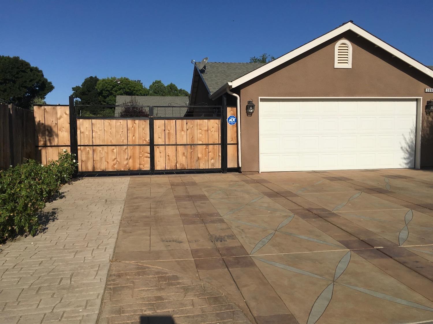 RV parking.  Notice the beautiful stamped concrete!  Full hook up.