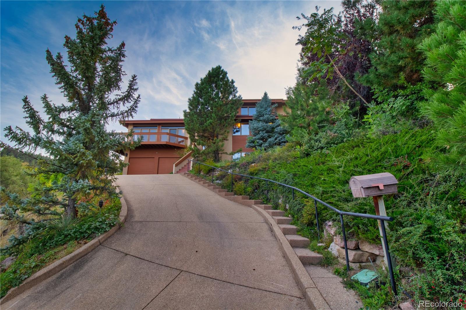265 Bellevue Drive Boulder, CO 80302 - Photo 6 of 32 a pathway of a house with a yard and potted plants