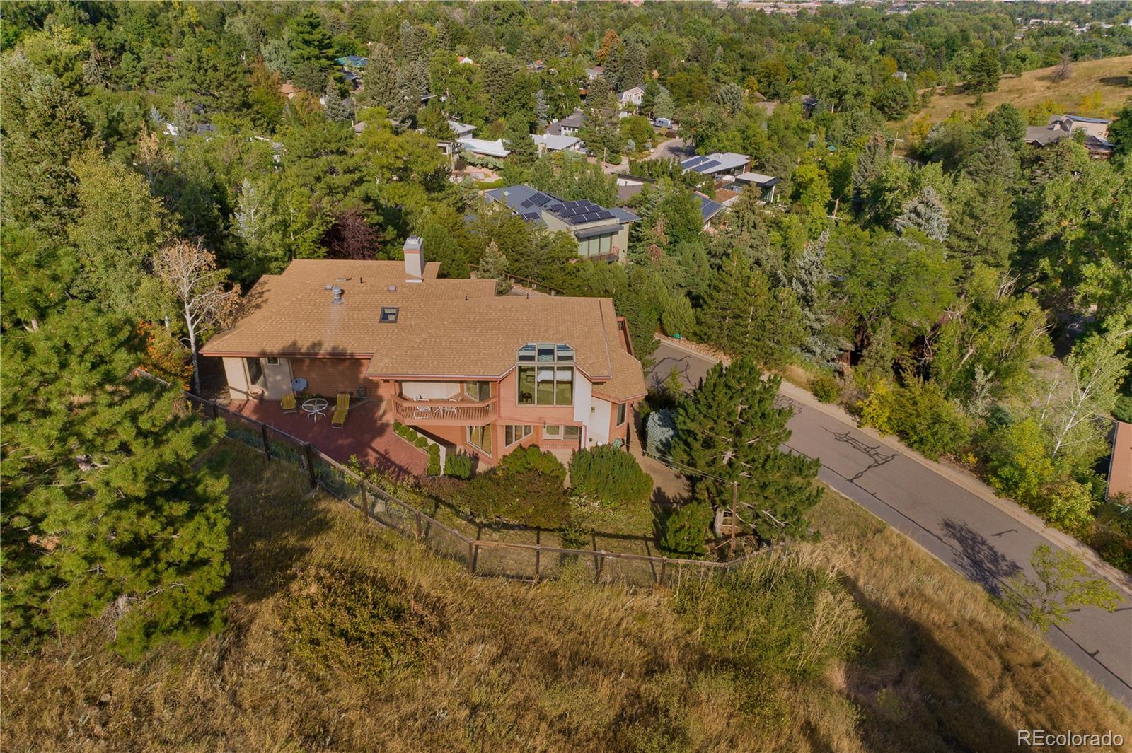 265 Bellevue Drive Boulder, CO 80302 - Photo 8 of 32 an aerial view of a house with a yard and large trees