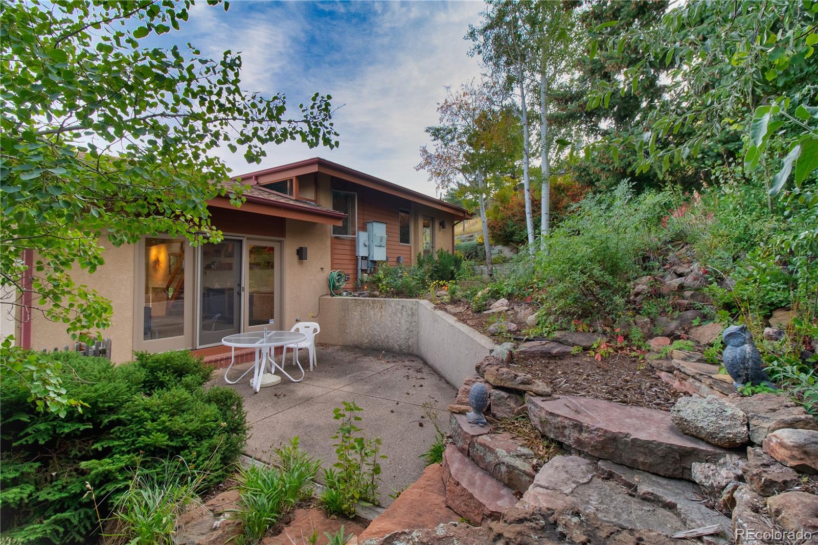 265 Bellevue Drive Boulder, CO 80302 - Photo 10 of 32 a view of a chair and table in backyard