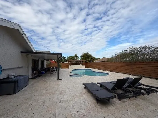 a view of a terrace with sitting area