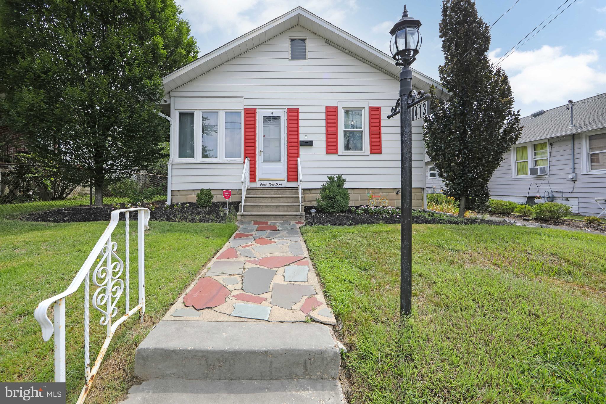 413 North Warwick Road Magnolia, NJ 08049 - Photo 1 of 40 a front view of house with yard