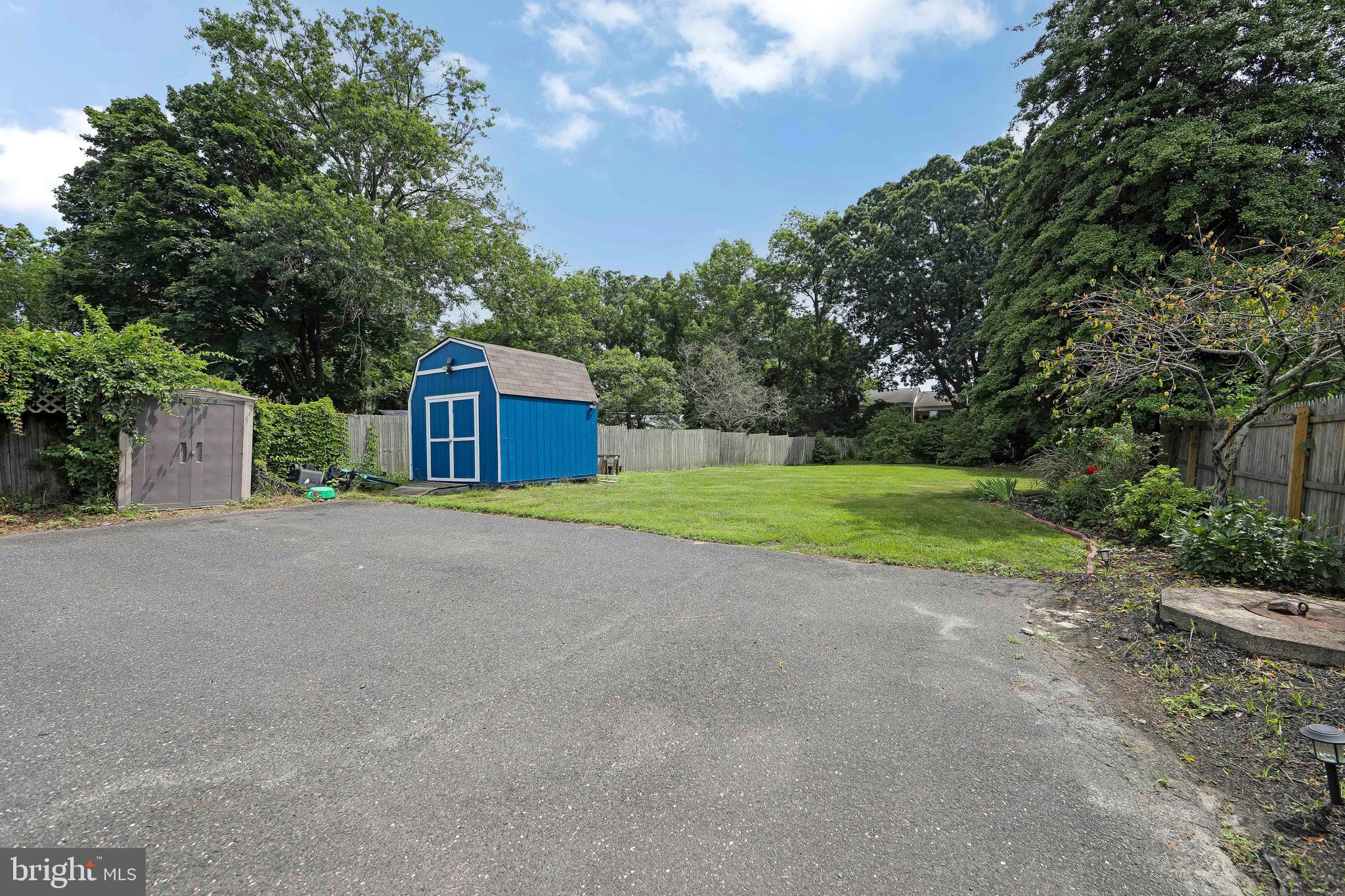 413 North Warwick Road Magnolia, NJ 08049 - Photo 37 of 40 a house view with a garden space
