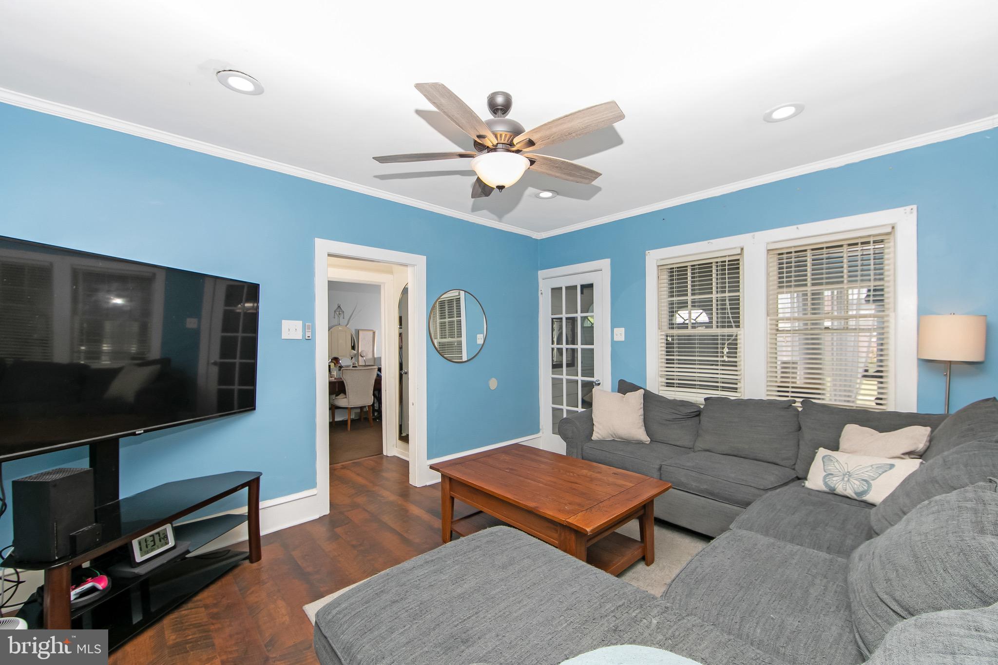 413 North Warwick Road Magnolia, NJ 08049 - Photo 8 of 40 a living room with furniture and a flat screen tv