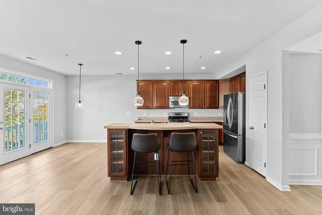 a kitchen with a table and chairs in it