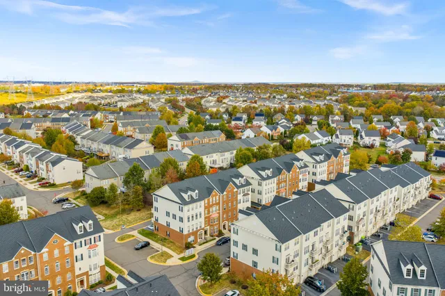 an aerial view of a house with a swimming pool