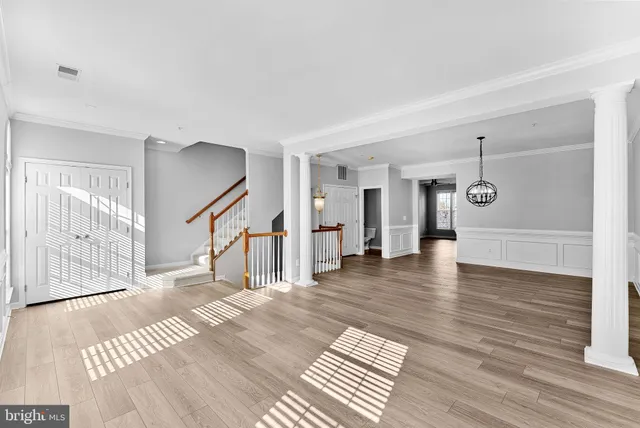 a view of an entryway with wooden floor