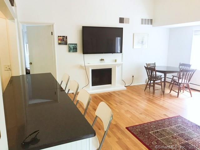 9 Talcott Ridge Road, Unit B2 Farmington, CT 06032 - Photo 1 of 1 Bright and sunny combination living and dining space with wood burning fireplace.