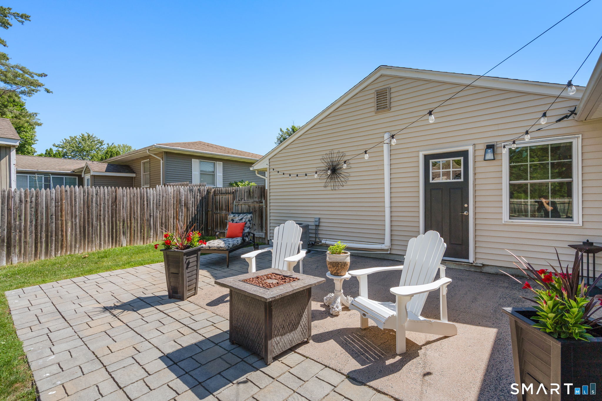 31 Cowan Street Suffield, CT 06078 - Photo 23 of 29 a view of backyard with outdoor seating and plants