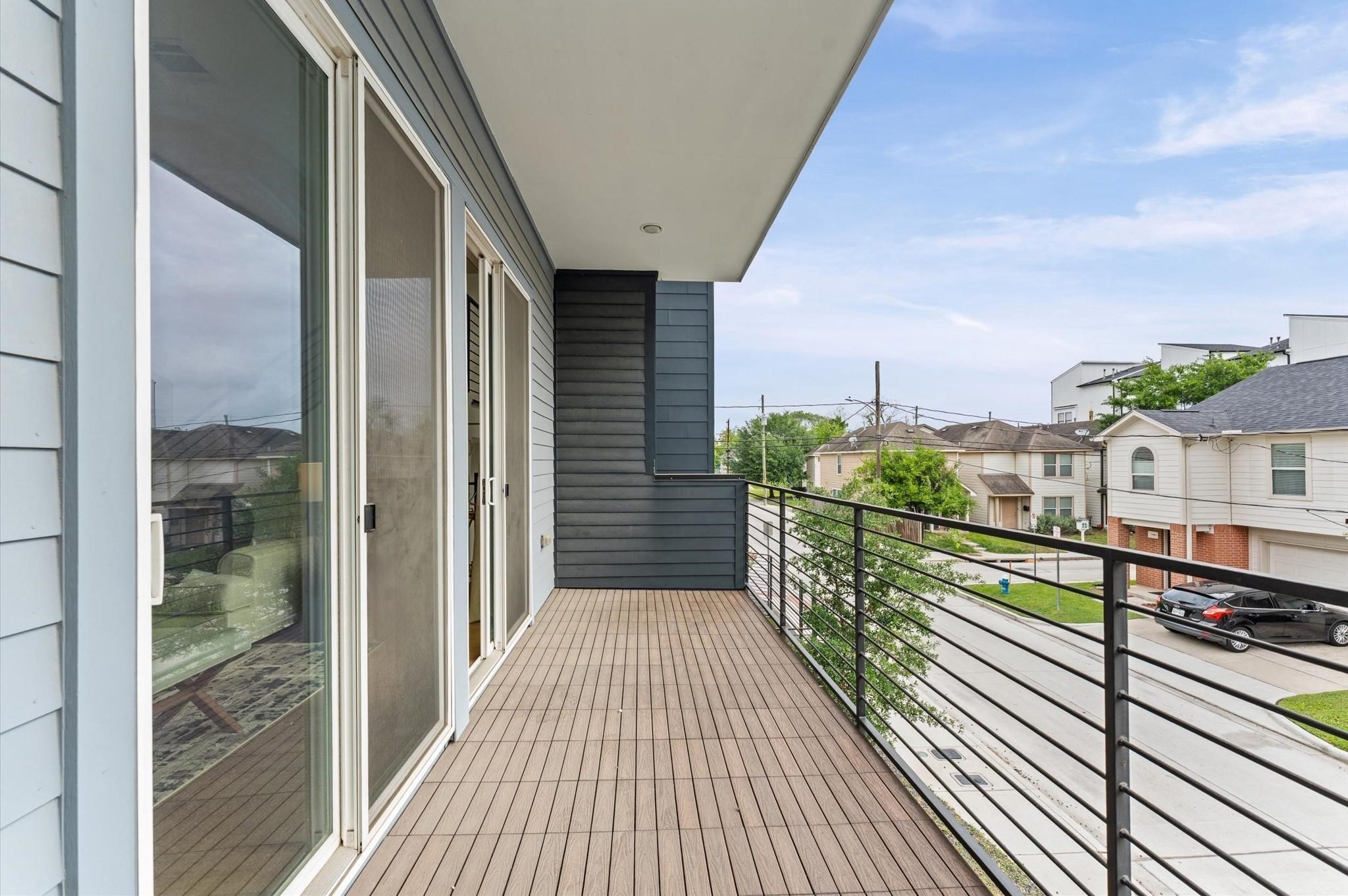 1404 Bailey Street Houston, TX 77019 - Photo 8 of 23 a view of balcony with wooden floor and city view