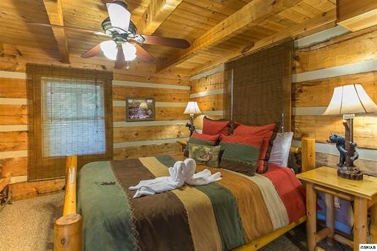1758 Bluff Ridge Road Sevierville, TN 37876 - Photo 11 of 13 a bedroom with a bed and wooden floor