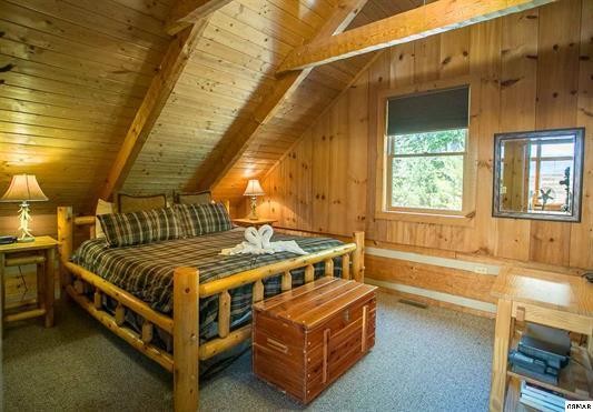 1758 Bluff Ridge Road Sevierville, TN 37876 - Photo 4 of 13 a bed sitting in a room next to a window
