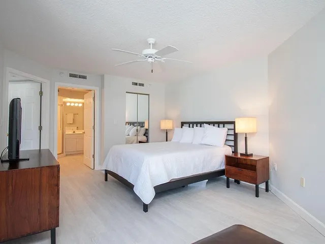 a bathroom with a granite countertop sink mirror and a