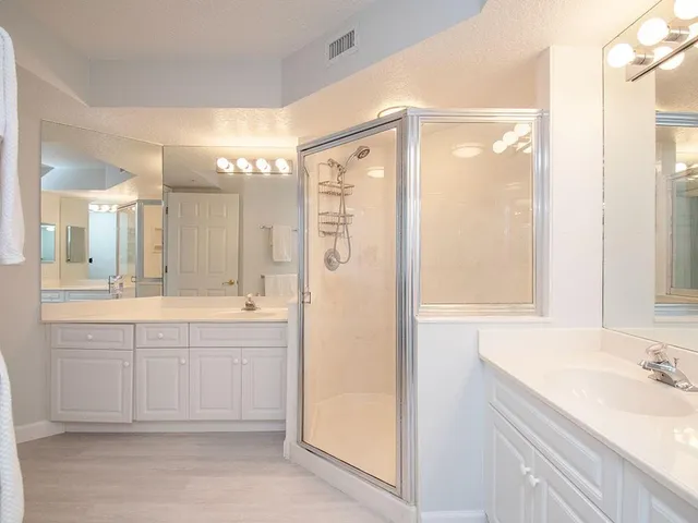 a bedroom with two beds and a window