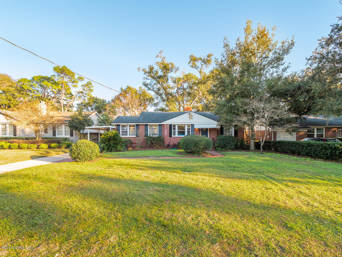 3981 Gadsden Road Jacksonville, FL 32207 - Photo 1 of 34 a front view of a house with a big yard