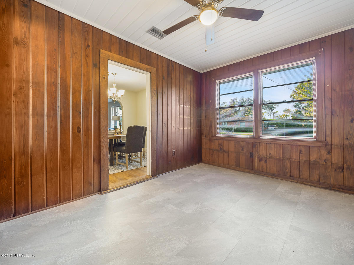 3981 Gadsden Road Jacksonville, FL 32207 - Photo 15 of 34 an empty room with windows and fan