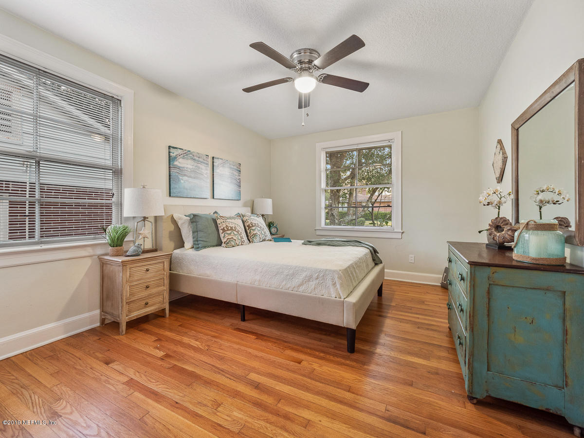 3981 Gadsden Road Jacksonville, FL 32207 - Photo 24 of 34 a bedroom with a large bed and a dresser