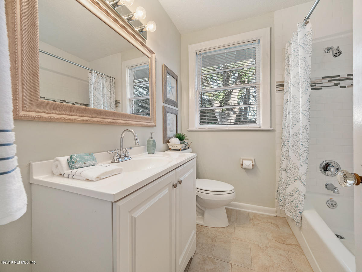 3981 Gadsden Road Jacksonville, FL 32207 - Photo 28 of 34 a bathroom with a sink toilet and shower