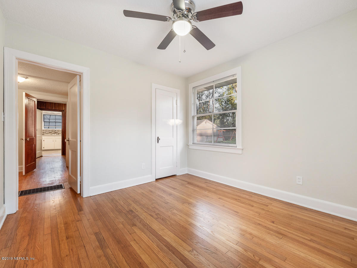 3981 Gadsden Road Jacksonville, FL 32207 - Photo 30 of 34 a view of empty room with wooden floor