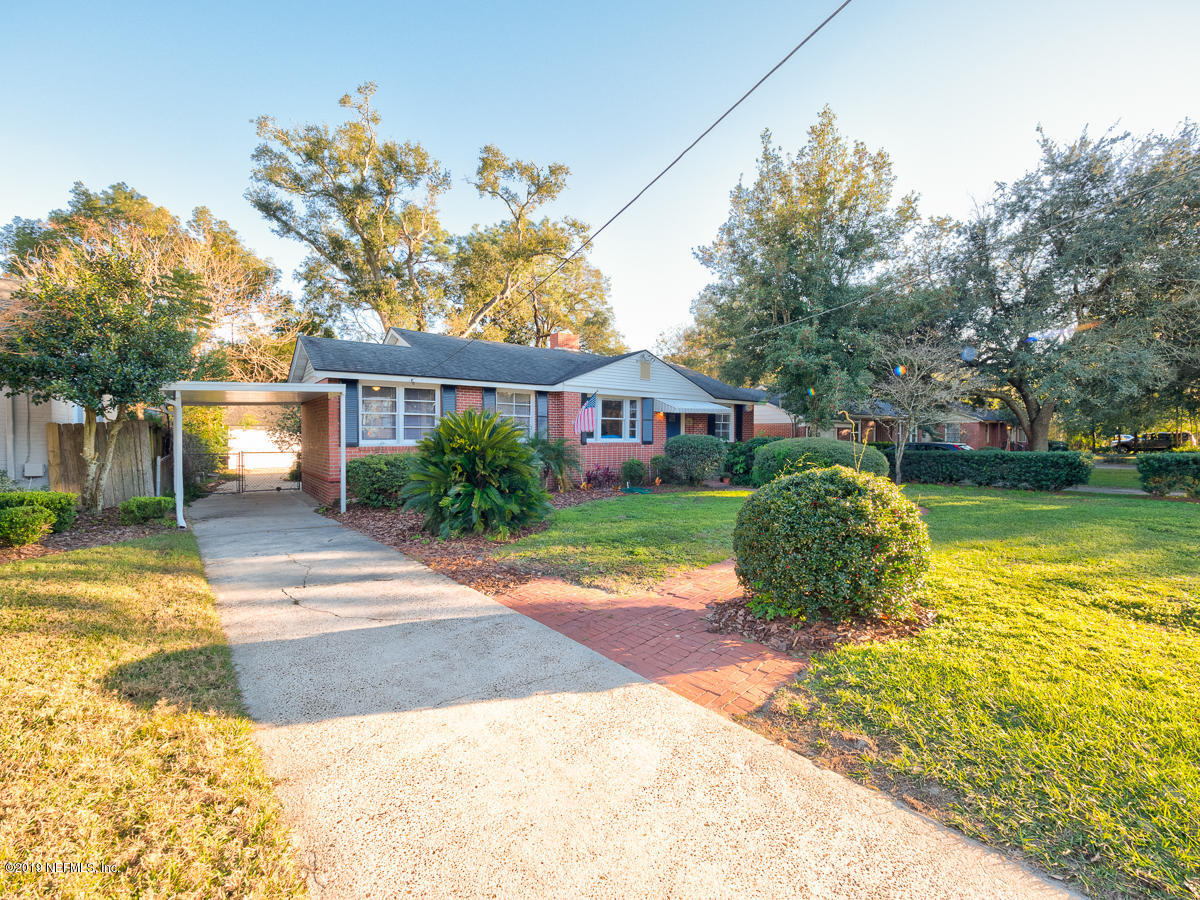 3981 Gadsden Road Jacksonville, FL 32207 - Photo 3 of 34 a view of a house with a yard and potted plants
