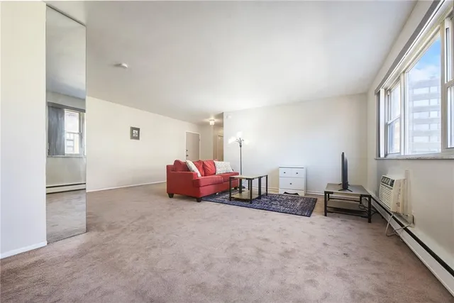 a spacious bedroom with a bed and cabinets