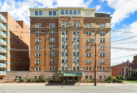 a front view of a building with street view
