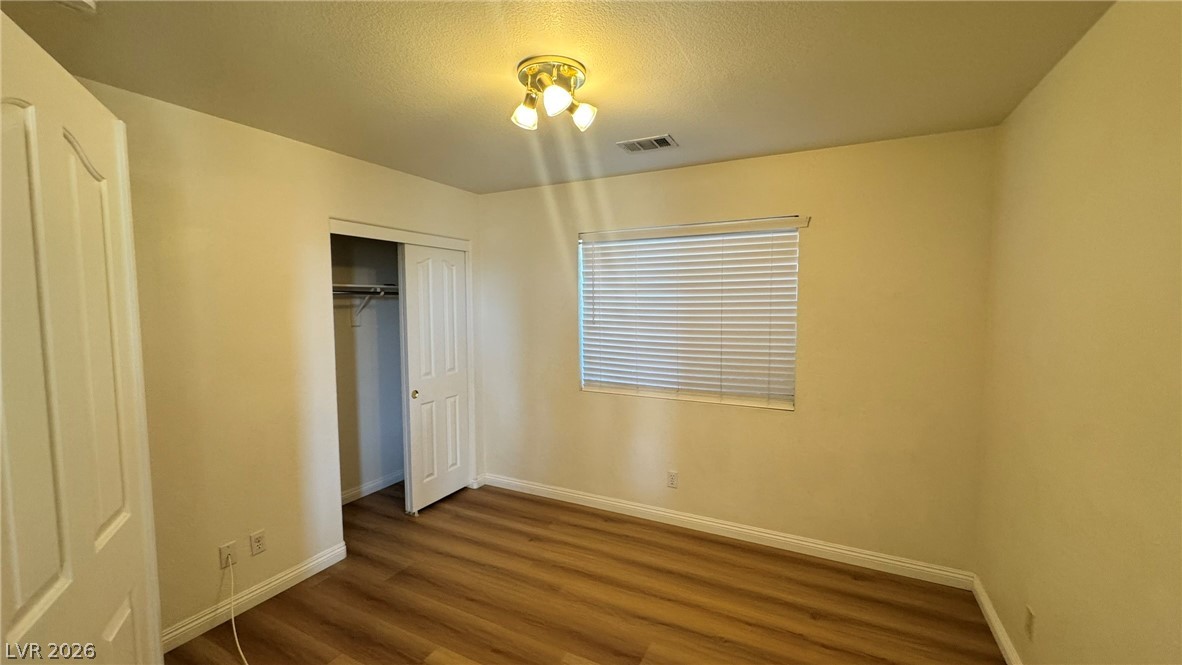 9716 Ridge Creek Place Las Vegas, NV 89134 - Photo 10 of 28 This spacious room features ample closet space and elegant flooring.