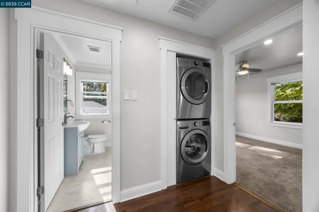 a view of a hallway with washer and dryer