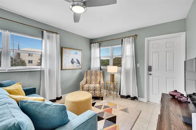 a view of a balcony with plants and palm trees
