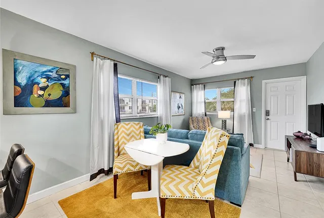 a view of a livingroom with furniture and a window