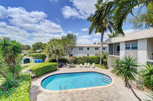 a kitchen with a sink cabinets and window