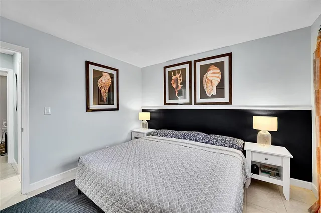 a living room with furniture and a night stand