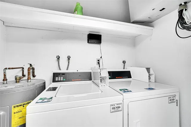 an aerial view of a house with a garden and lake view